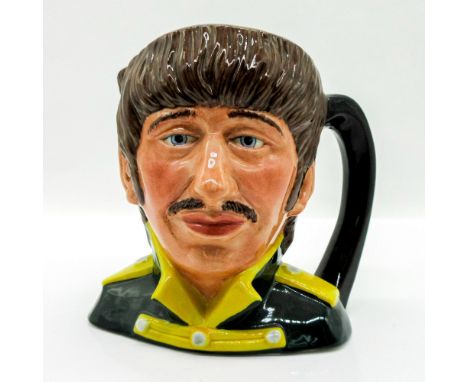 Black tunic; yellow collar and epaulettes.Series: The Beatles. Royal Doulton backstamp. Artist: Stanley J. TaylorIssued: 1984