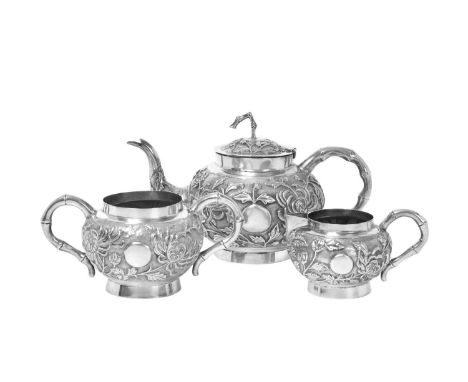 A Three-Piece Silver Tea-Service,  Incuse Maker's Mark T?, Perhaps Indian, 20th Century in the Chinese export style, each pie