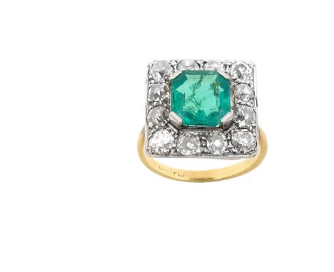 An Emerald and Diamond Cluster Ringthe emerald-cut emerald within a border of old cut diamonds, in white claw and millegrain 