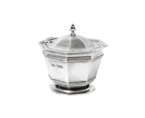 An Edward VII Silver Tea-Caddy,  by Mappin and Webb Ltd., London, 1909 tapering octagonal and on spreading foot, the hinged c