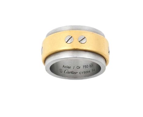A Bi-Colour 'Santos' Ring, by Cartierthe broad white band overlaid with a smaller yellow band with screw head motif decoratio