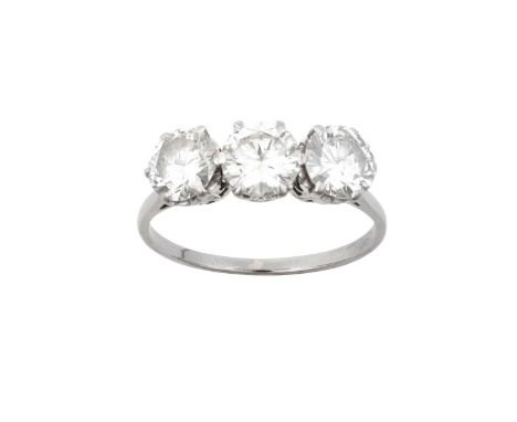 A Diamond Three Stone Ringthe round brilliant cut diamonds in white claw settings, to a tapered shoulder plain polished shank