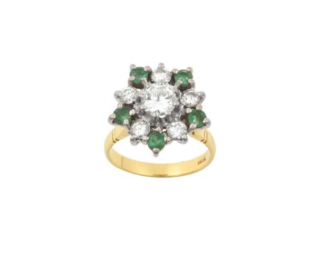 An Emerald and Diamond Cluster Ringthe round brilliant cut diamond within a border of smaller round brilliant cut diamonds al