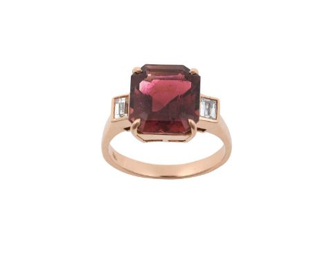 A Tourmaline and Diamond Ringthe emerald-cut reddish purple tourmaline in a rose four claw setting, to baguette cut diamond s