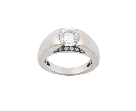 A Diamond Solitaire Ringthe round brilliant cut diamond in a white tension setting, with a round brilliant cut diamond set ga