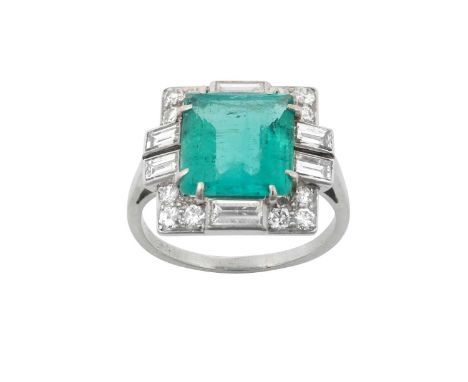 An Art Deco Emerald and Diamond Cluster Ringthe rectangular cut emerald within a border of old cut and baguette cut diamonds,