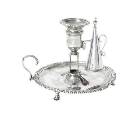 A George III Silver Chamber-Candlestick,  by Timothy Renou, London, 1793 the base shaped circular and on three tapering feet,
