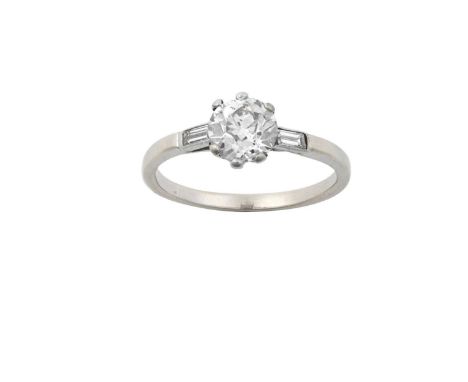 A Diamond Solitaire Ringthe old cut diamond in a white claw setting, to baguette cut diamond set shoulders, on a plain polish