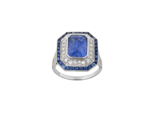 An Art Deco Style Sapphire and Diamond Cluster Ringthe cushion cut sapphire within a stepped border of eight-cut diamonds, to