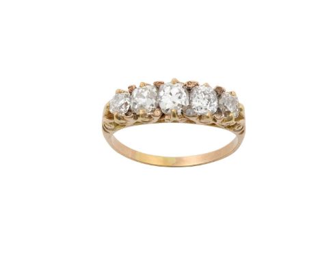 A Diamond Five Stone Ringthe graduated old cut diamonds in yellow claw settings, with rose cut diamond accents, to a plain po