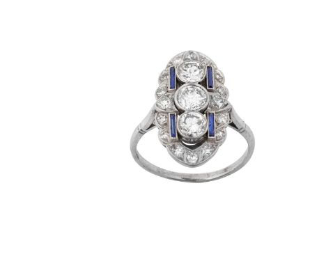 A Synthetic Sapphire and Diamond Cluster Ring, circa 1930the oval plaque positioned up the finger, formed of old cut and eigh