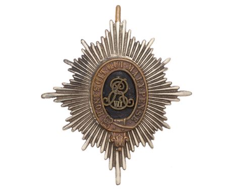 Dragoons Edwardian Foreign Service helmet plate c. 1901-10.  Good die-stamped white metal elongated fluted star mounted with 