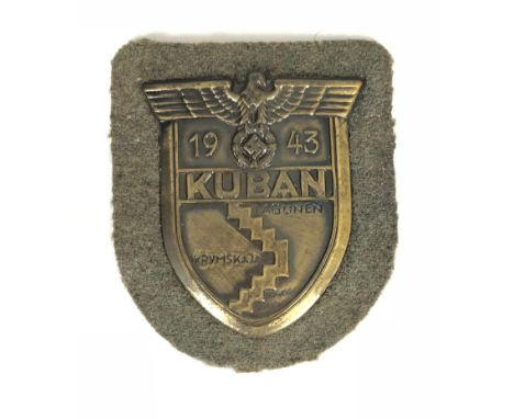 German Third Reich WW2 Army and Waffen-SS Kuban Arm shield.  Good scarce laquered brass example on field grey cloth. Eagle an