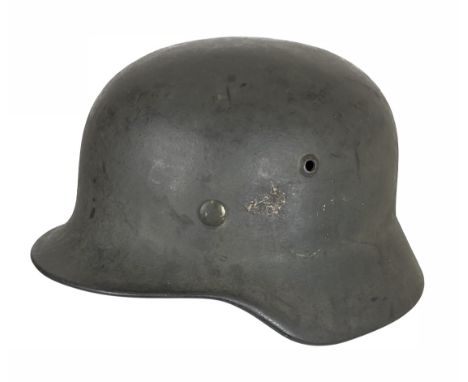 WW2 German Third Reich 1940 Army Combat Helmet.  This turned edge example, with green painted finish. The interior with leath