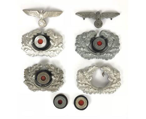 German Third Reich Army cap insignia.  Two eagle and swastikas complete with fixings (one by C.T.C) ... four oak wreaths (3 w