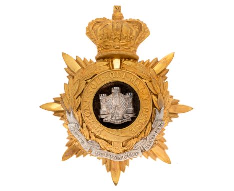Devonshire Regiment Victorian Officer's helmet plate badge c. 1881-1901.  Good rich gilt crowned star mounted with The Garter