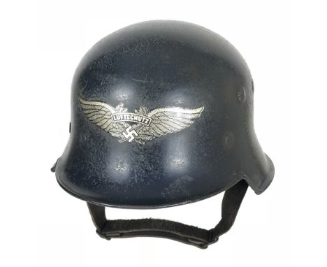 German Third Reich WW2 Luftschutz steel helmet.  A good clean example. The combat shape helmet with blue painted finish, with
