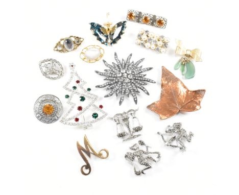 A large selection of 15 costume jewellery brooch pins. The brooches to include paste, pearl, M, butterfly, abalone, Christmas