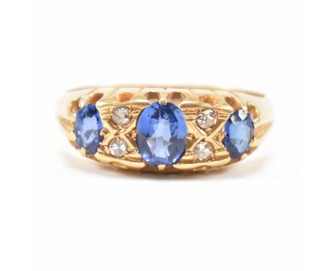 An early 20th century hallmarked 18ct gold sapphire and diamond ring. The antique ring set with three oval cut sapphires and 