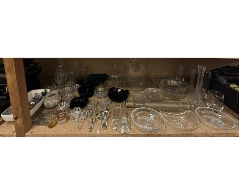 Glass tea light holders together with glass decanters, decanter stoppers, glass rolling pin, glass vases, glass fruit, colour