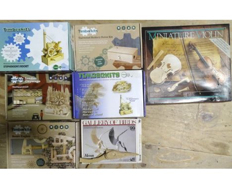 Seven wooden construction kits, including five Timber kits, a&nbsp;quantity of card construction kits: aircraft, ships, cars,