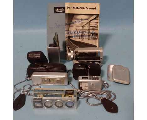 A Minox sub-miniature camera, cased, with accessories: flash gun attachment, (cased), binocular adapter, light meter (cased) 