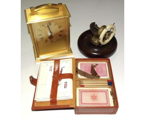 A wood and metal nutcracker in the form of a ship's wheel, a modern brass mantel clock by Baronet, a Royal Life Saving Societ