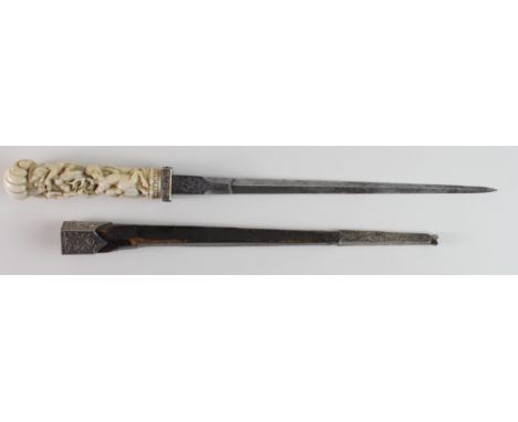 Stiletto dagger, circa 17th / 18th century, with leather scabbard and engraved white metal mounts, grip with ornate carved de