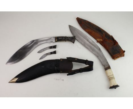 Knives: Kukris: 1) a good Kukri blade 12" with decorated horn grip. In leather scabbard with military belt loops &amp; frog. 