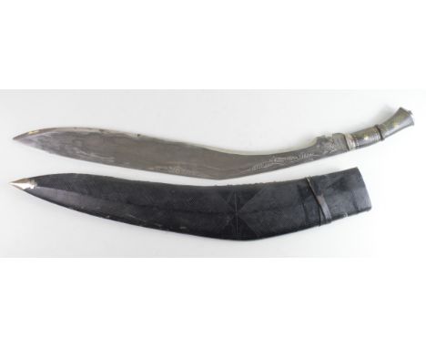 Kukri: A giant tourist Kukri. Heavy blade 30" pricker marked 'India'. In its leather scabbard. (*Mind your fingers when remov