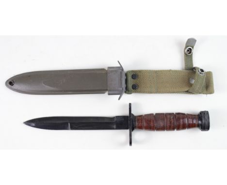 Bayonet: A U.S. M1 Carbine bayonet. Ricasso with makers mark name 'Kiefe' &amp; 'Japan'. In its USM8AI plastic scabbard marke