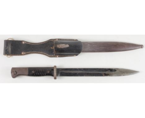 German Mauser knife bayonet, blade stamped 'P 8975' and '41 clc'. Bakelite handle, with metal scabbard and leather frog dated