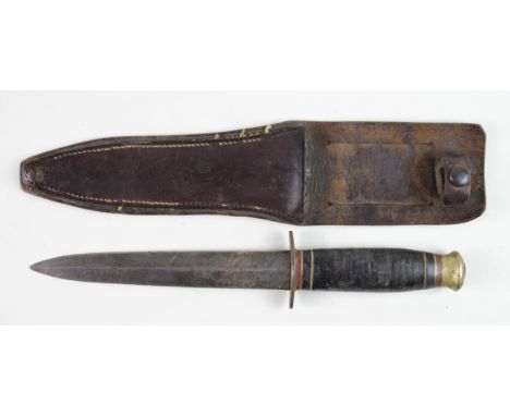 Knife: A 'Taylor Withers' fighting knife circa WW2. D/edged blade 7" with leather washer hilt. Brass X Guard and pommel. In i