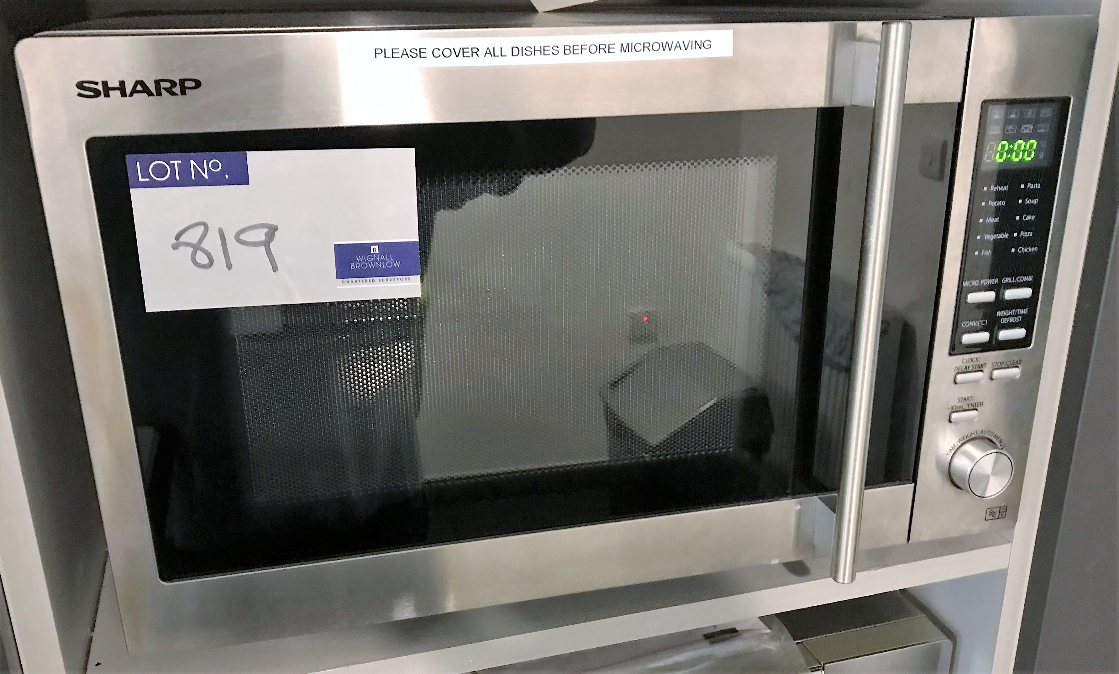 A Sharp R-92STM Microwave Oven.
