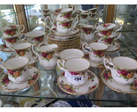 A Royal Albert country Roses six setting tea and coffee set with 12 side plates, sandwich plate, two jugs and sugar bowls and