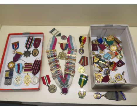An RMB RMI sash with year bars and approx 40 assorted medals 