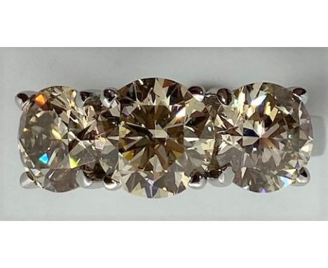 A stunning 18ct white gold three stone diamond ring, hallmarked, total weight approx 4.06cts, all stones are well matched, ri