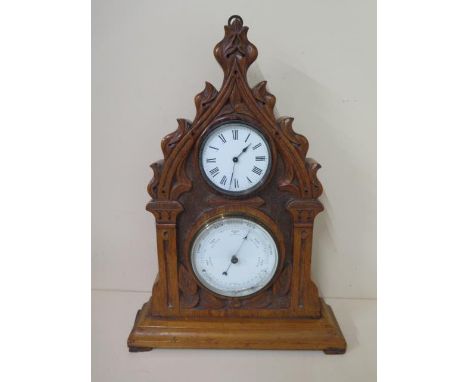 A gothic oak clock barometer with thermometer, 43cm tall, ticks but stops, hand off barometer otherwise reasonably good 