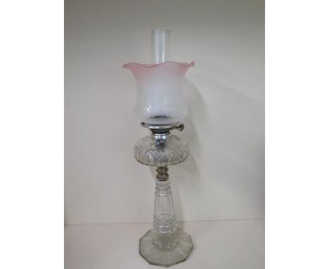 A 19th century oil lamp, glass base and font, 67cm tall, some scratches but generally good 