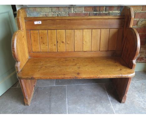 A pitch pine pew hall bench, 89cm tall x 100cm wide x 53cm deep 