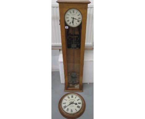 A Synchronome electric Master clock in an oak case numbered 26714 to dial, 6 1/2 inch dial signed Munsey Co Ltd Cambridge, wi