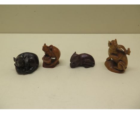 Two carved wooden netsukes and two similar carved figures, one netsuke signed to base, tallest 5.5cm, all good condition 