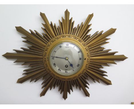 A sunburst wall clock, 8 day movement by Elliott of London, in good working order, 47cm x 33cm 