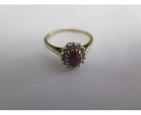 A hallmarked 9ct ruby and diamond ring, size O, approx 0.15ct, approx 2.4 grams, generally good condition 