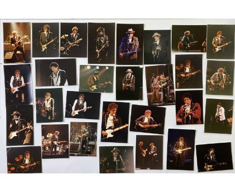 38 photographs depicting Bob Dylan, chiefly on stage c 1989 - 1991, most to measure 8 x 12", with photographers sticker to ve
