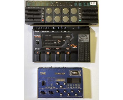 A Roland GR33 Guitar Synthesizer, a Vox Valvetronix Tonelab, and a Yamaha Digital Drum Bank DD-10. 