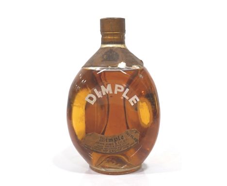 HAIG'S DIMPLE 1960sA bottle of Haig's Dimple Blended Scotch Whisky from the 1960s.  26 2/3 Fl. ozs.  70 proof.  Level mid-sho