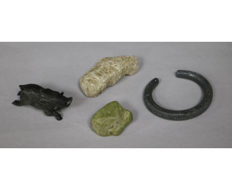 A collection of miscellaneous curios, including a coprolite specimen, a Celtic style iron torch with engraved decoration, a c