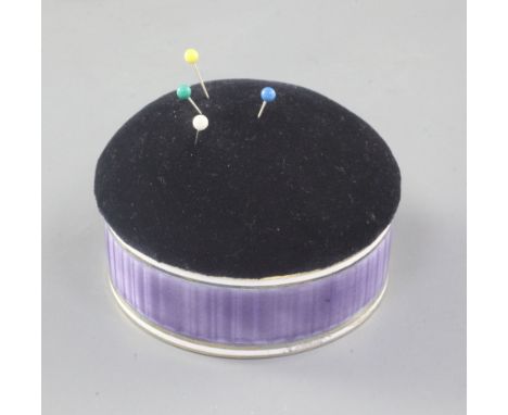 A George V silver and purple guilloche enamel mounted circular pin cushion, by Henry Matthews, Birmingham, 1929, 81mm.