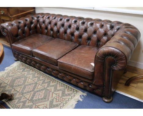 A leather Chesterfield sofa W.209cm